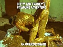 In cowshit, girls are playing and masturbating.